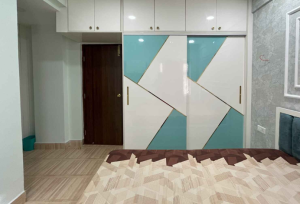 Two-tone laminate wardrobe design by Chennai’s expert interior designers in Chennai
